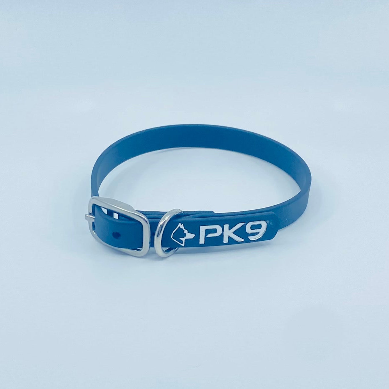 Blue dog collar with 'PK9' branding on a light gray background
