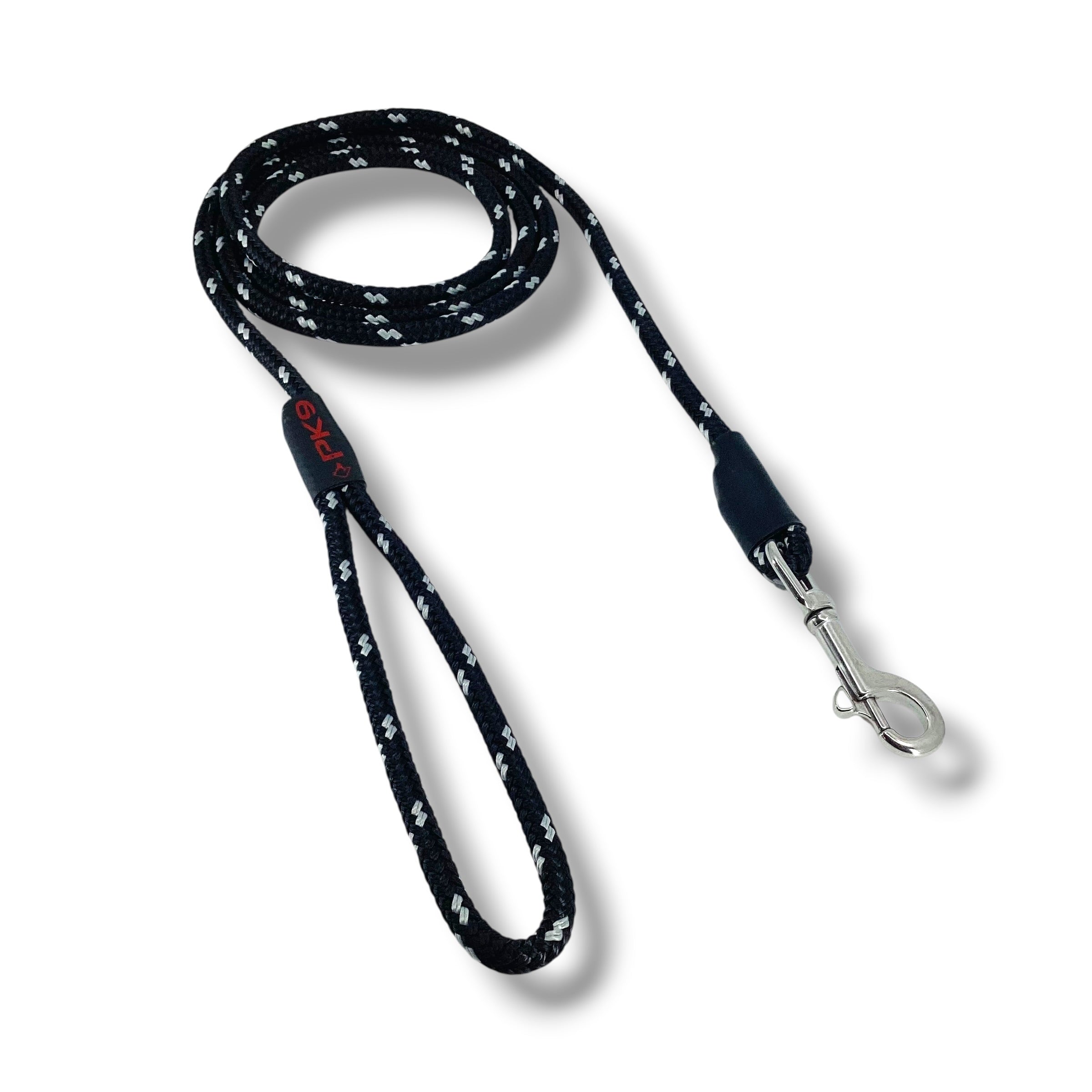Black dog leash with white paw prints on a white background