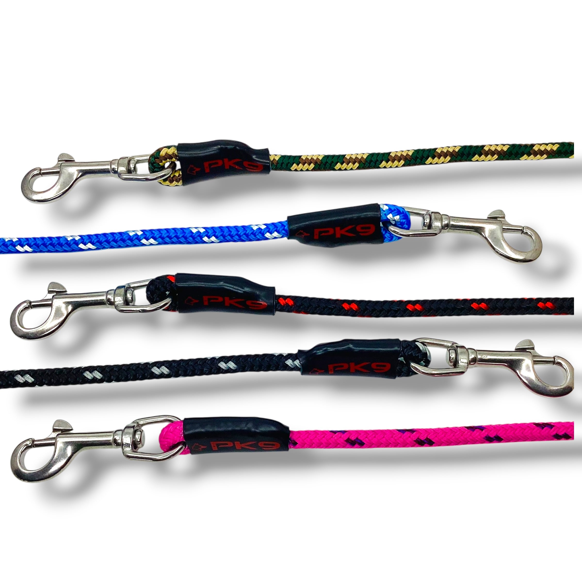 Four dog leashes with different color patterns and metal clasps on a white background.