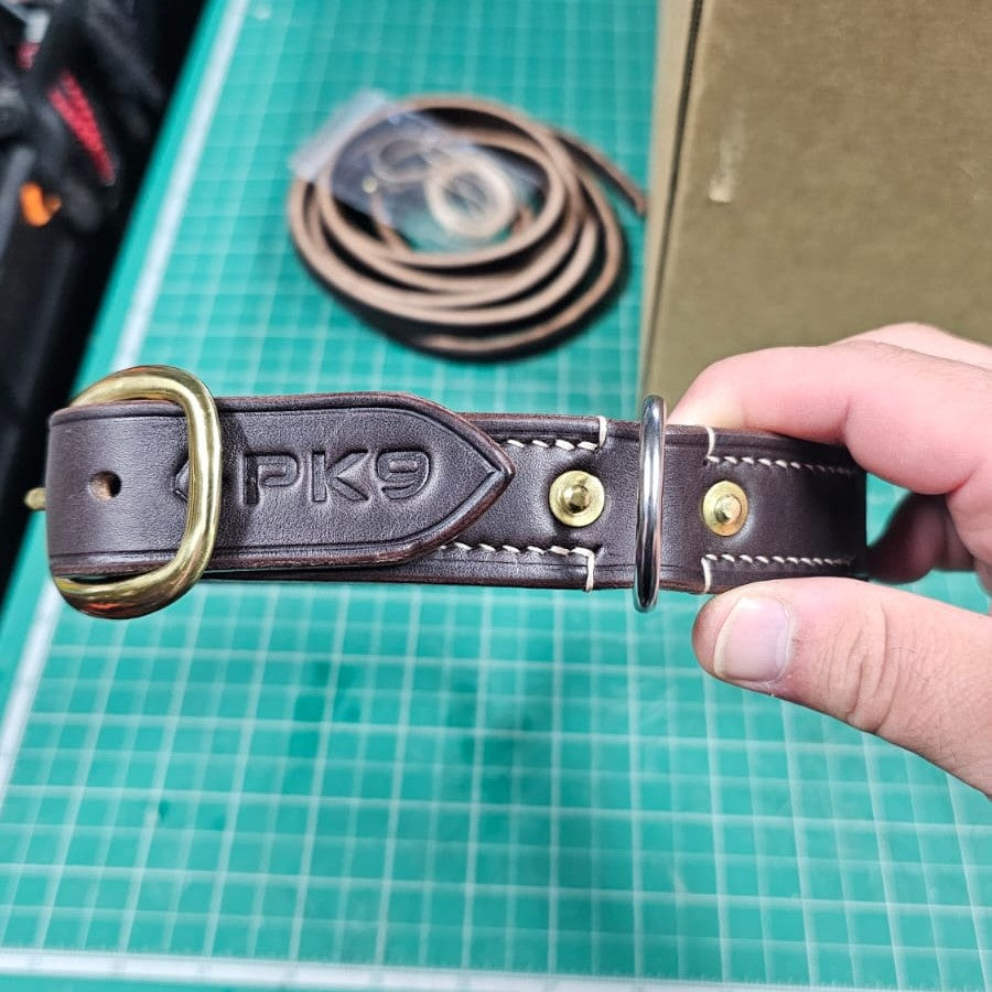 Brown leather dog collar with 'PK9' branding 