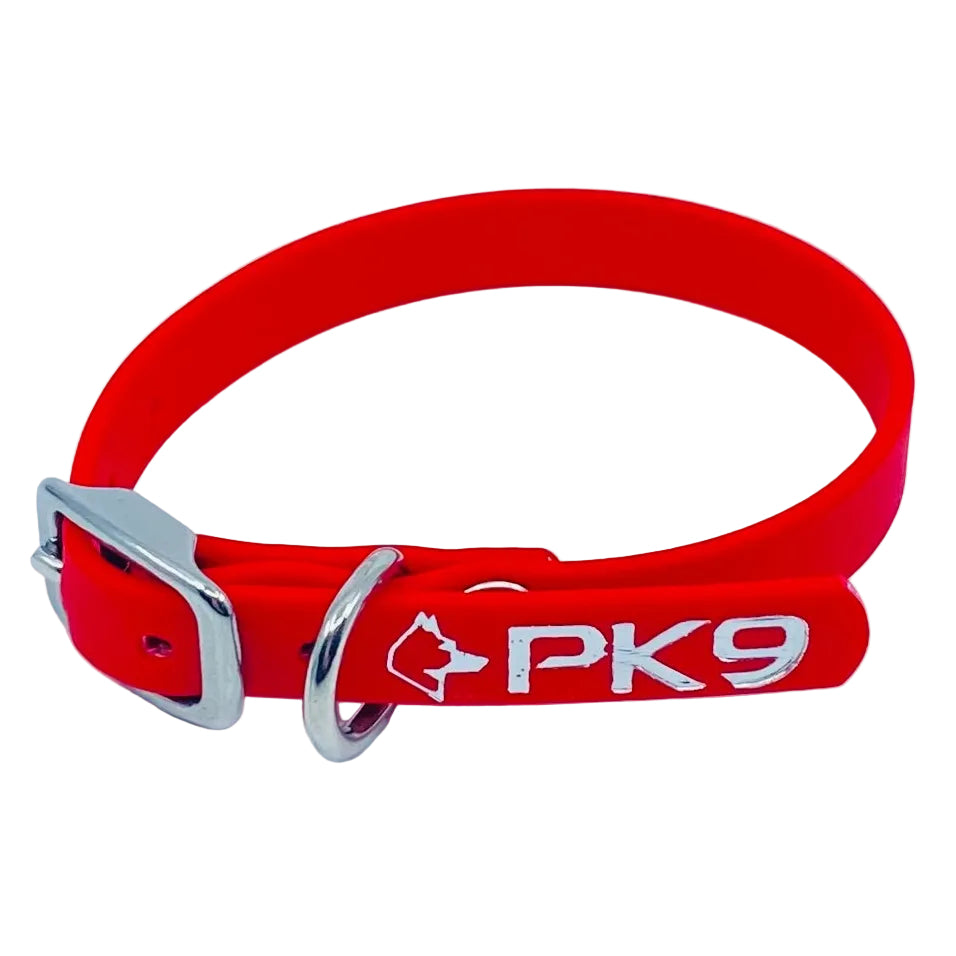 Red dog collar with a visible brand logo on a light gray background