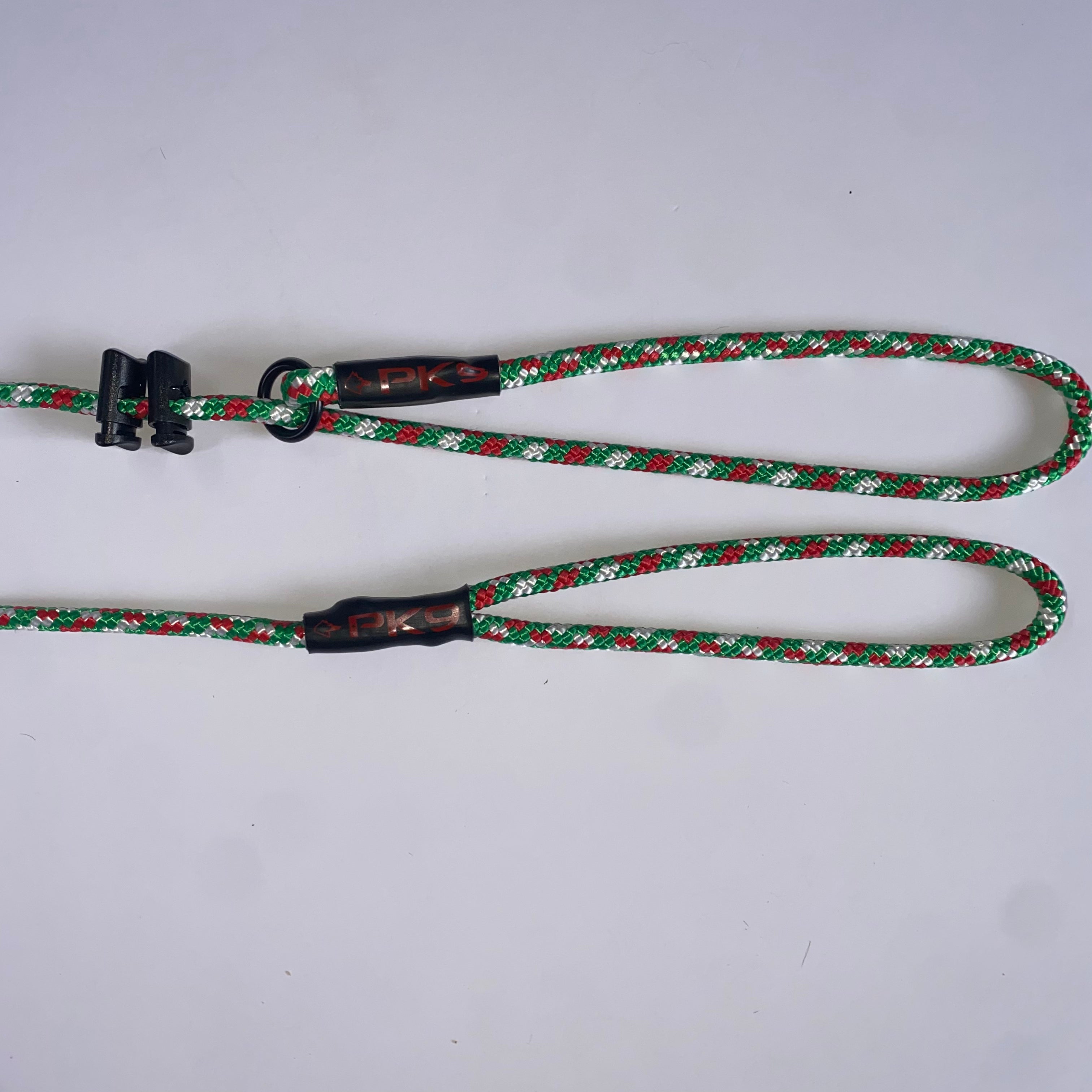 Green and red patterned dog leash on a white background