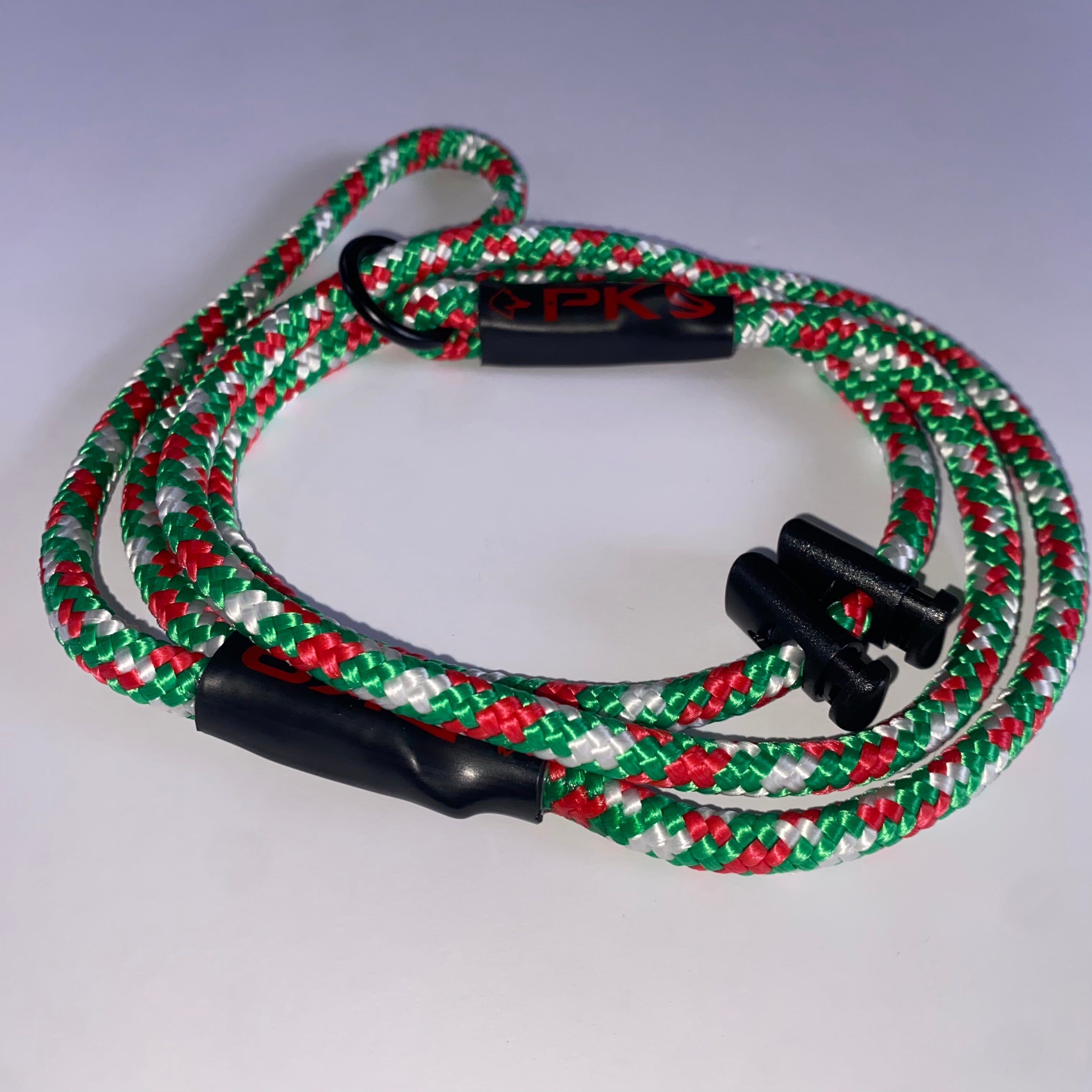 Red, green, and white braided leash with black clips on a gray background