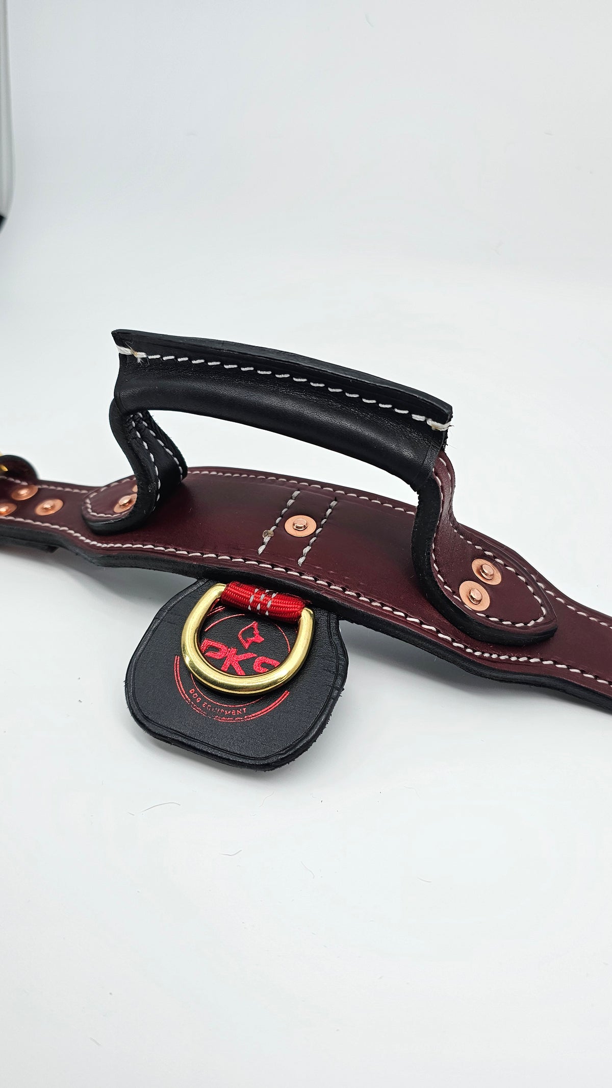 Solid handle and BlueWater webbing securing the D-ring on the tactical leather collar
