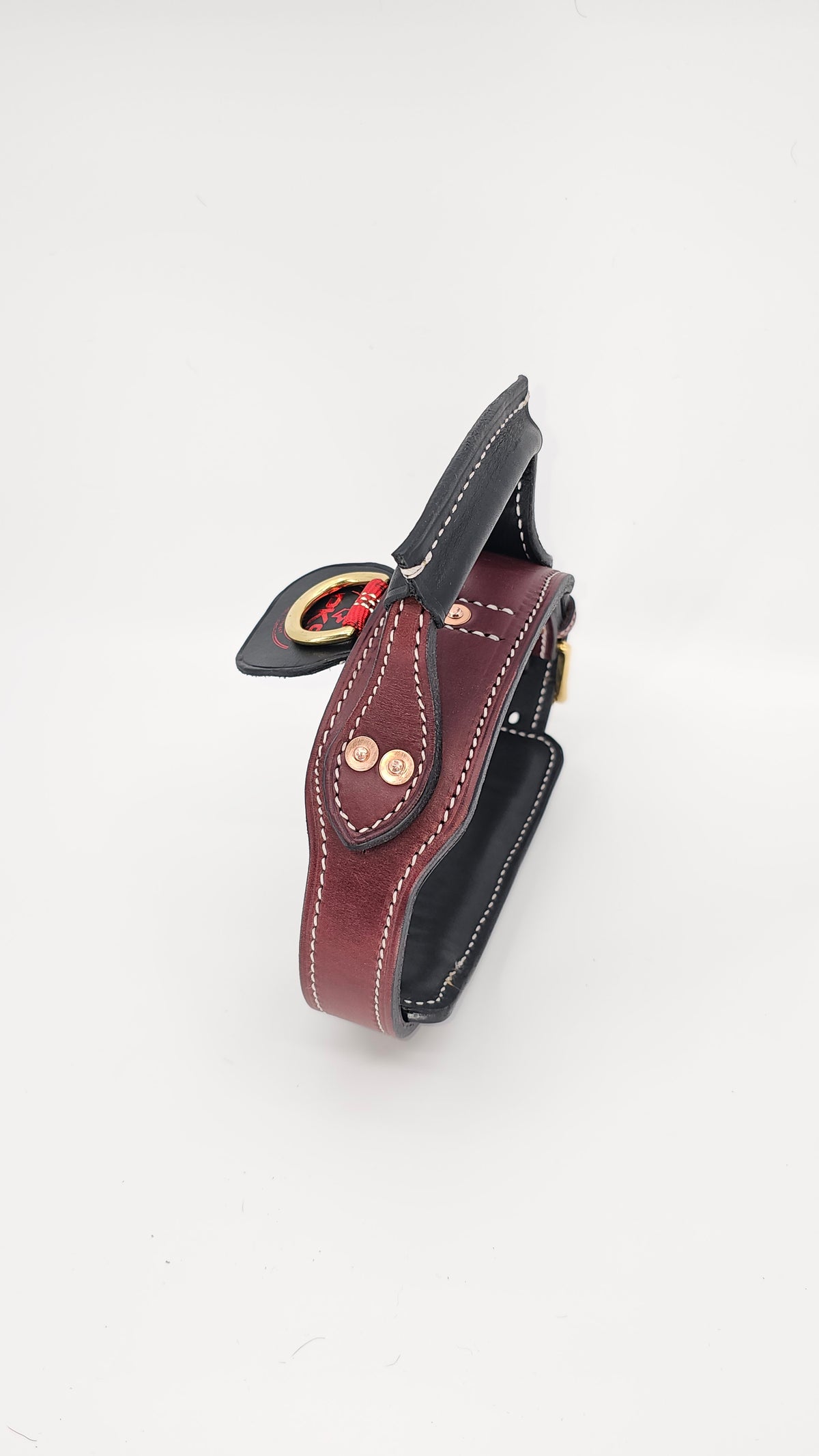 Side profile of the dual-ply tactical leather collar, raised handle and rivet attachments